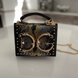 DG logo black and gold snake pattern genuine leather bag w gold chain. NWOT